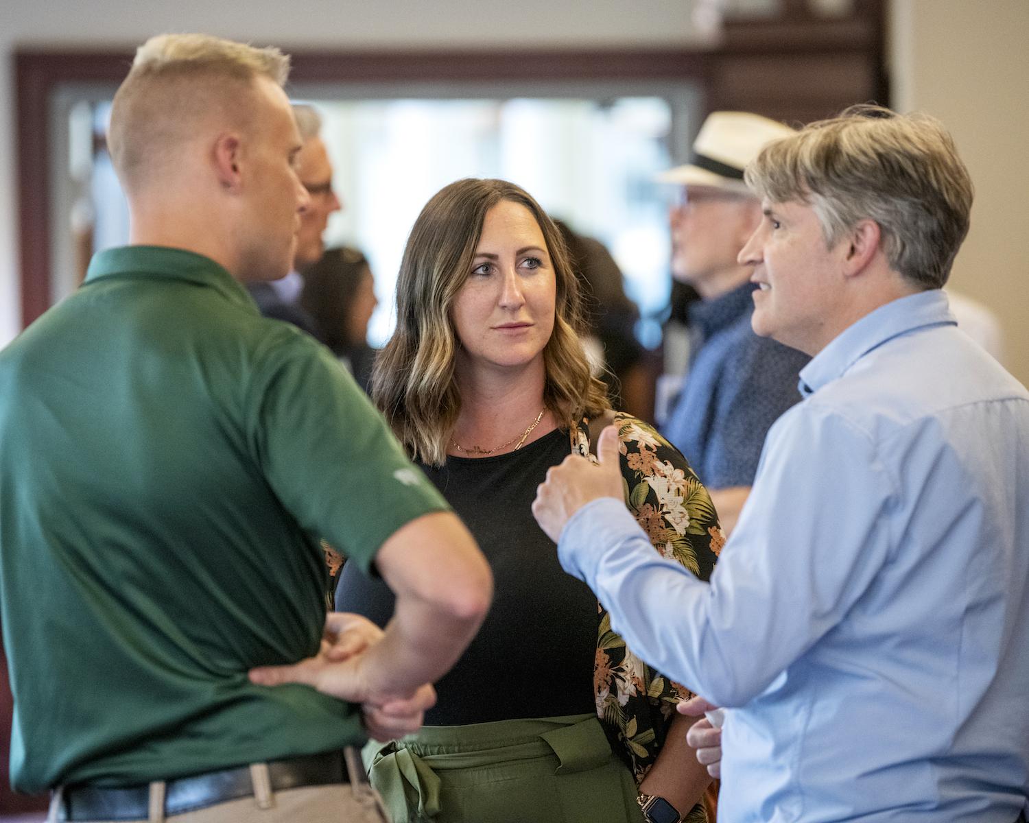Individuals mingle  at the Fall 2023 Mix and Mingle for faculty and staff 
